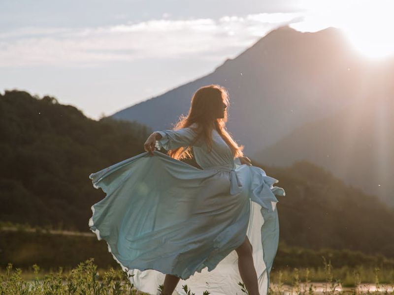 A person in a fluid yoga pose, showing movement and grace.